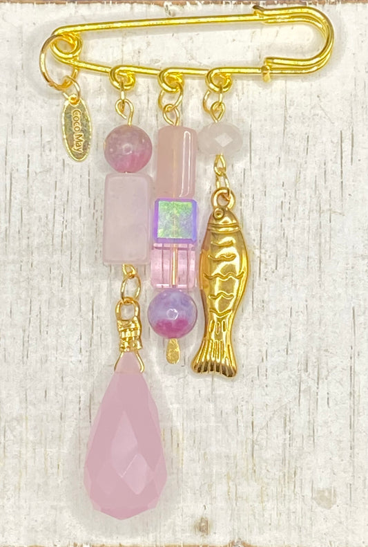 A FISH AMID THE ROSES BROOCH